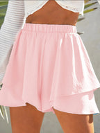 Elegant high-waisted layered shorts showcasing trendy summer fashion and comfortable style for women