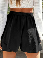 Elegant high-waisted layered shorts showcasing trendy summer fashion and comfortable style for women