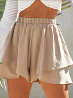 Elegant high-waisted layered shorts showcasing trendy summer fashion and comfortable style for women
