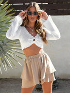 Elegant high-waisted layered shorts showcasing trendy summer fashion and comfortable style for women