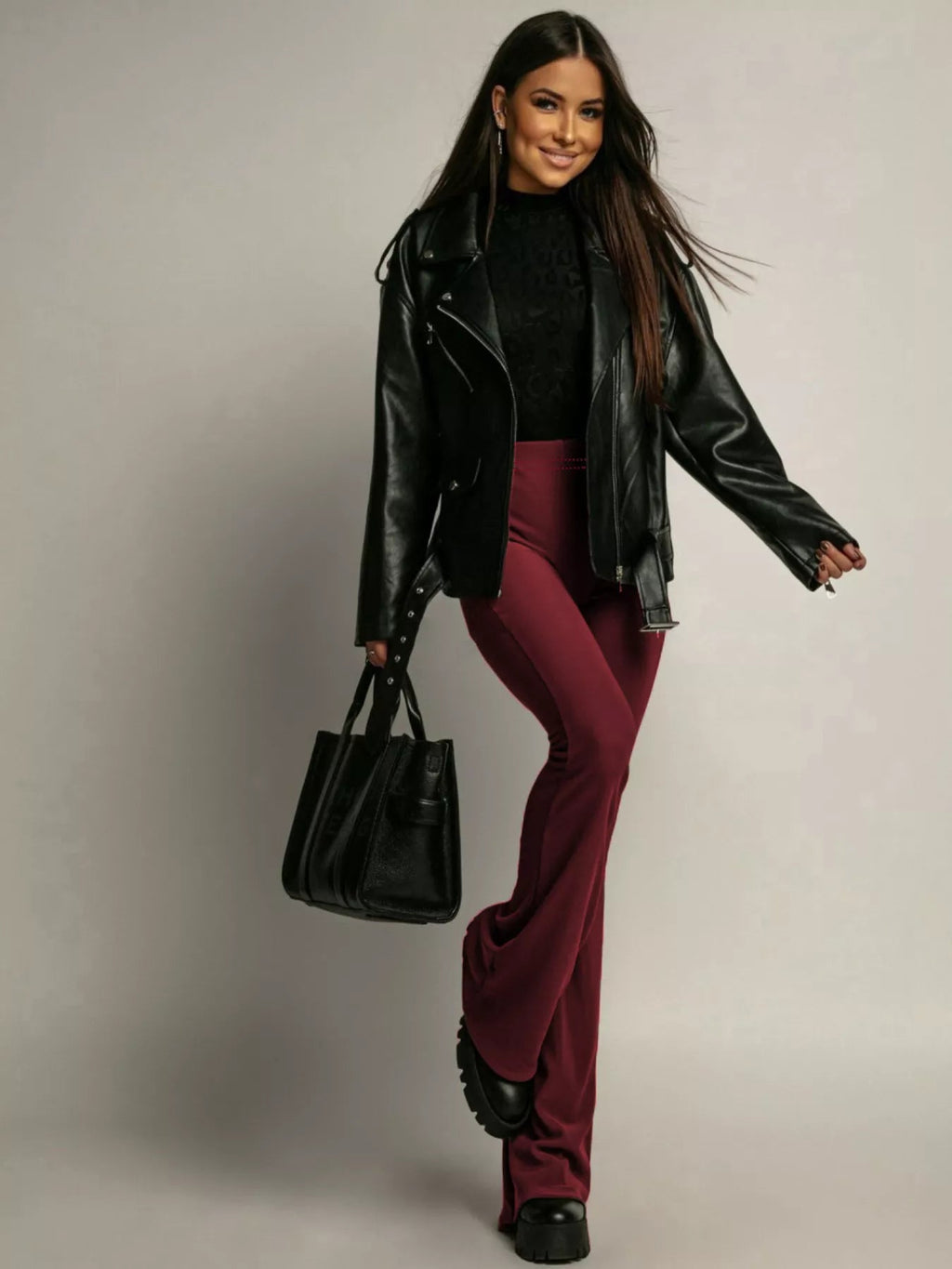 Elegant high-waisted flared pants perfect for a sophisticated and flattering silhouette in formal occasions.
