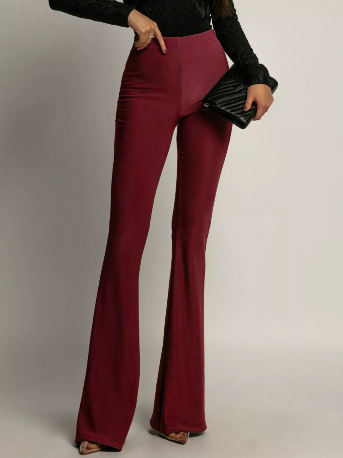 Elegant high-waisted flared pants perfect for a sophisticated and flattering silhouette in formal occasions.