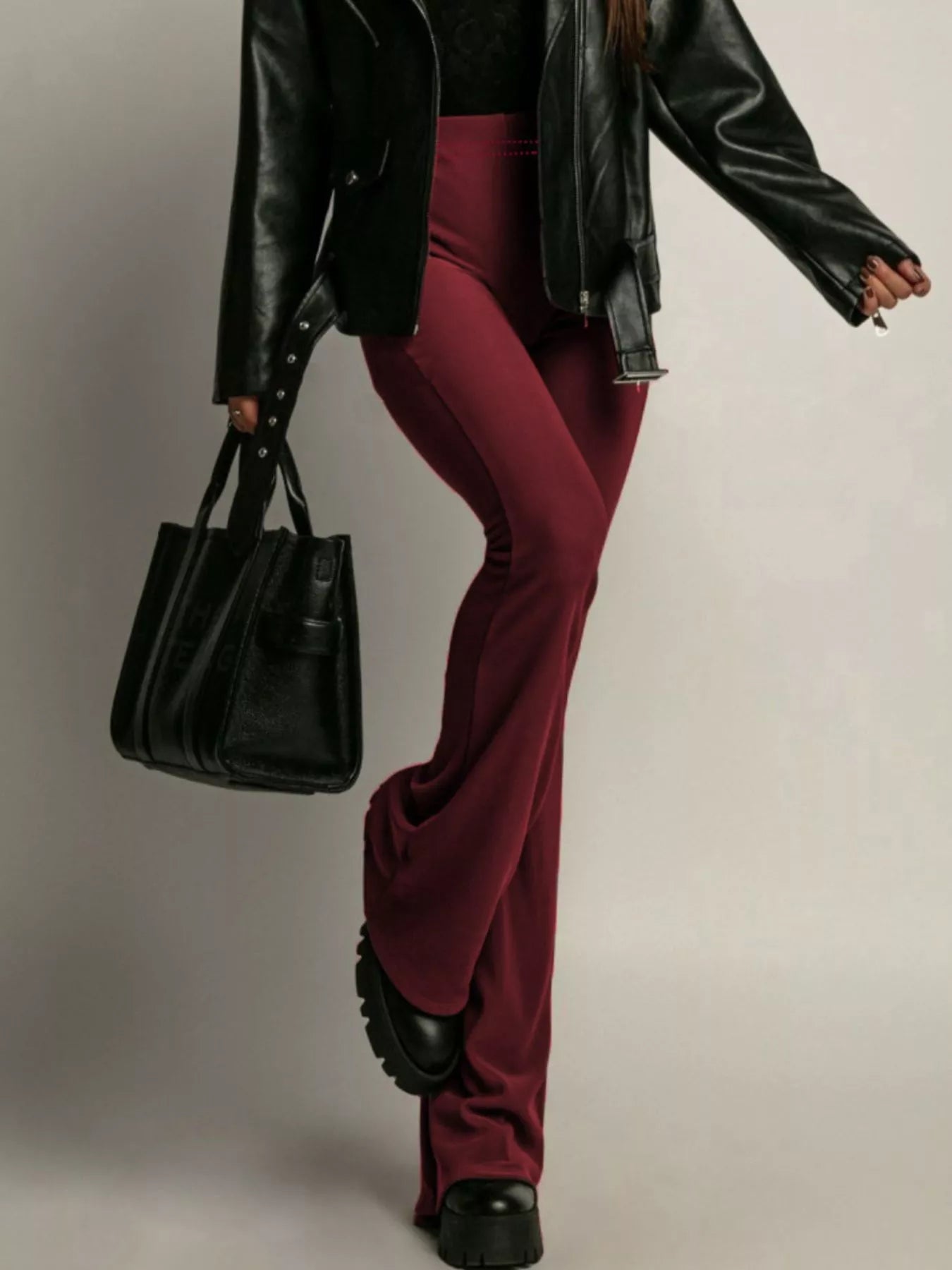 Elegant high-waisted flared pants perfect for a sophisticated and flattering silhouette in formal occasions.