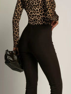 Elegant high-waisted flared pants perfect for a sophisticated and flattering silhouette in formal occasions.