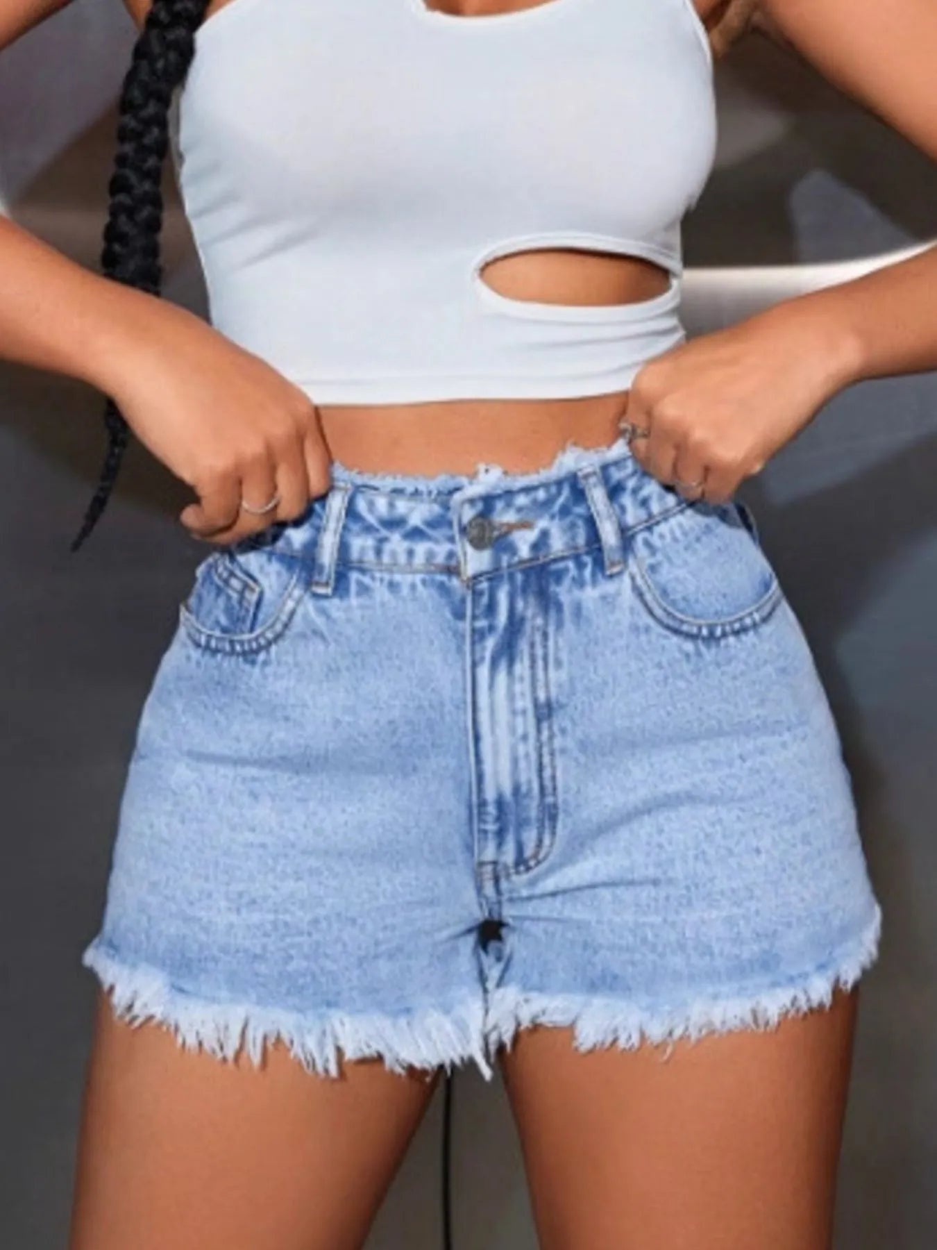 High waisted denim shorts providing a stylish and comfortable summer wardrobe essential for casual outings.