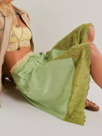 Elegant lace shorts showcasing intricate detailing and sophisticated style for a refined summer wardrobe.