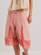 Elegant lace shorts showcasing intricate detailing and sophisticated style for a refined summer wardrobe.