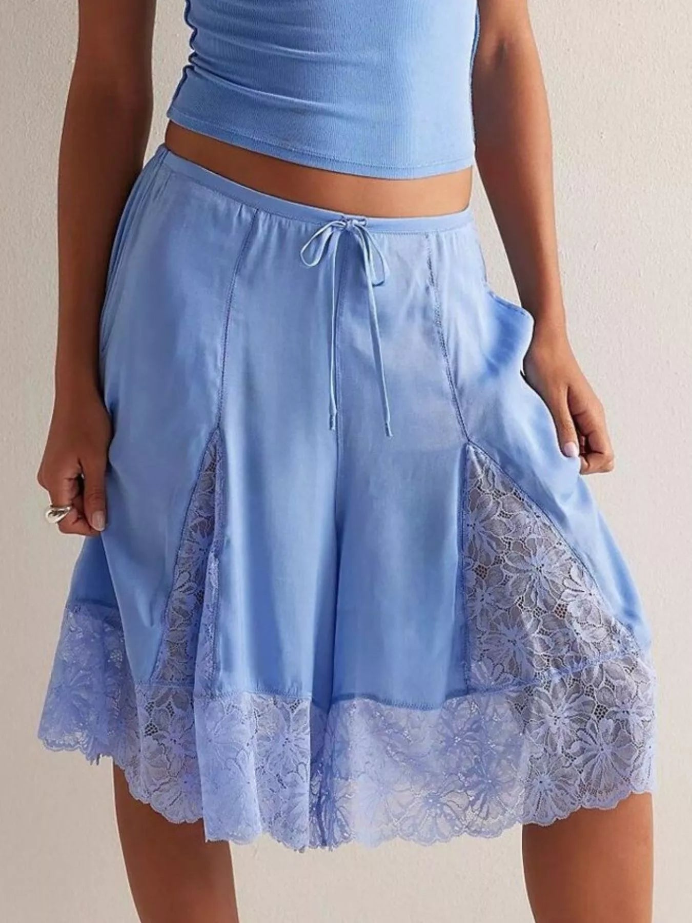 Elegant lace shorts showcasing intricate detailing and sophisticated style for a refined summer wardrobe.