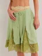 Elegant lace shorts showcasing intricate detailing and sophisticated style for a refined summer wardrobe.