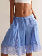 Elegant lace shorts showcasing intricate detailing and sophisticated style for a refined summer wardrobe.