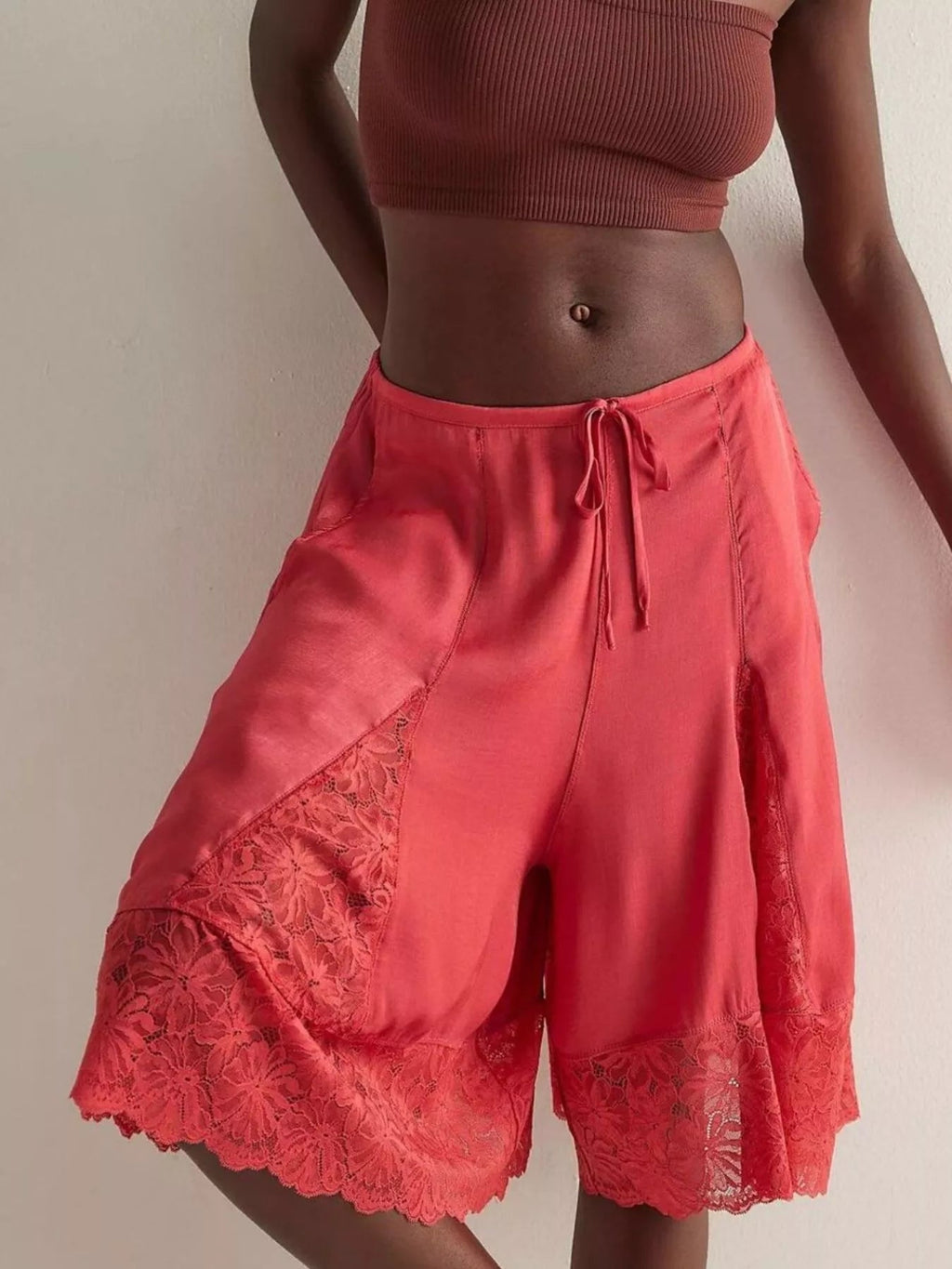 Elegant lace shorts showcasing intricate detailing and sophisticated style for a refined summer wardrobe.