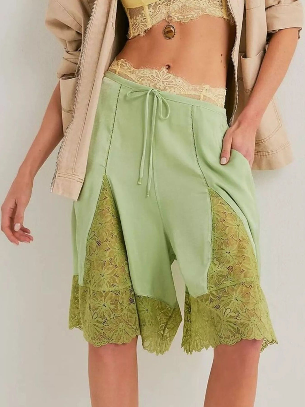 Elegant lace shorts showcasing intricate detailing and sophisticated style for a refined summer wardrobe.