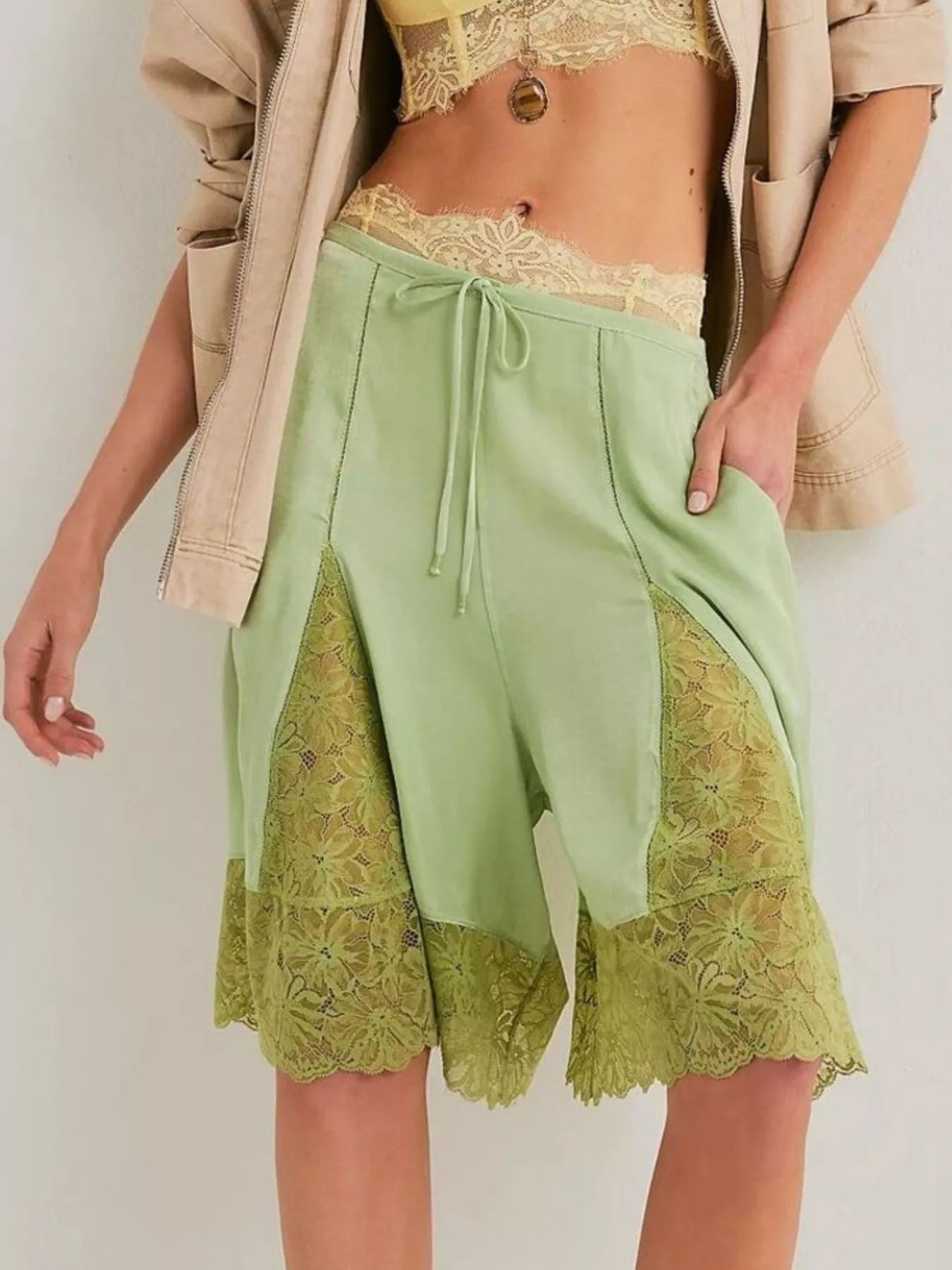 Elegant lace shorts showcasing intricate detailing and sophisticated style for a refined summer wardrobe.