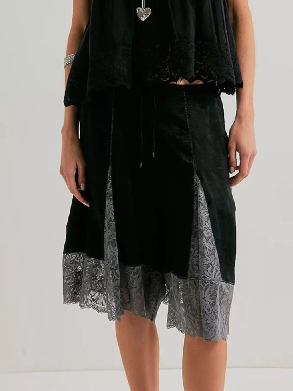 Elegant lace shorts showcasing intricate detailing and sophisticated style for a refined summer wardrobe.