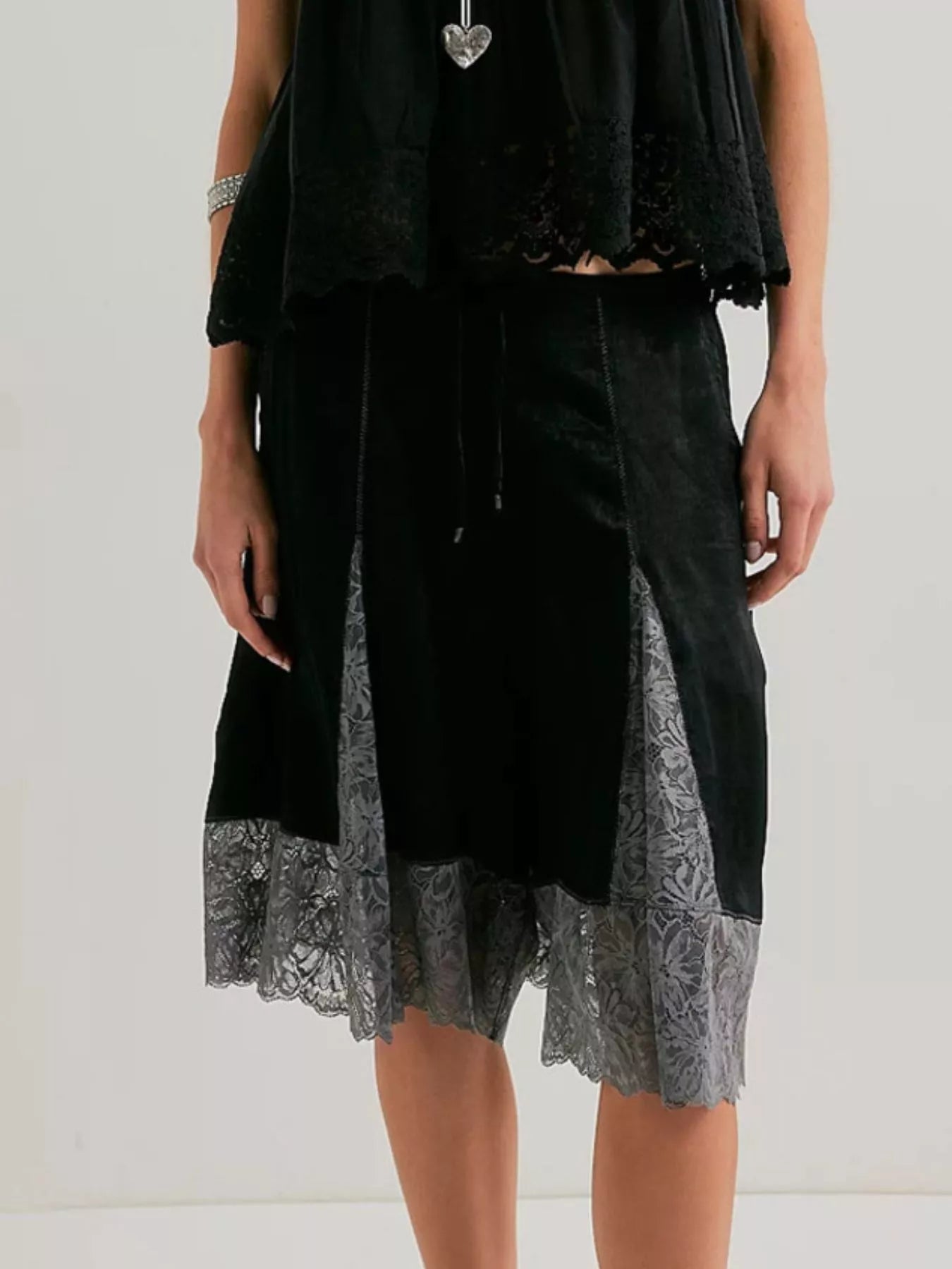 Elegant lace shorts showcasing intricate detailing and sophisticated style for a refined summer wardrobe.