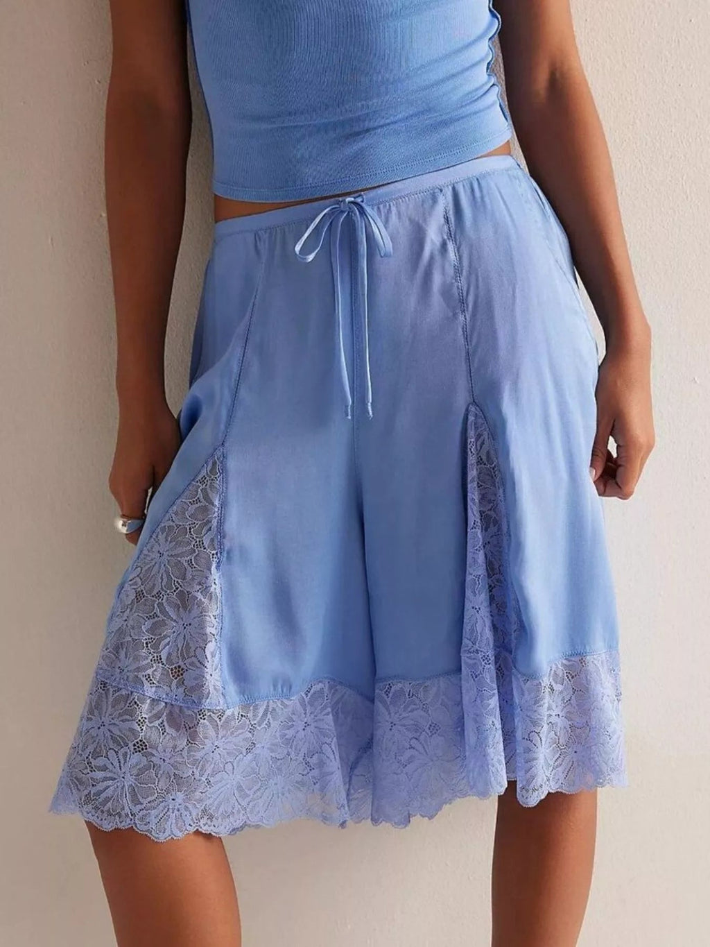 Elegant lace shorts showcasing intricate detailing and sophisticated style for a refined summer wardrobe.