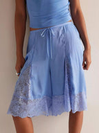 Elegant lace shorts showcasing intricate detailing and sophisticated style for a refined summer wardrobe.