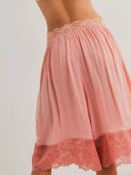 Elegant lace shorts showcasing intricate detailing and sophisticated style for a refined summer wardrobe.