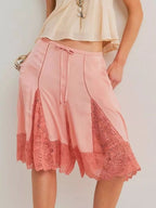 Elegant lace shorts showcasing intricate detailing and sophisticated style for a refined summer wardrobe.