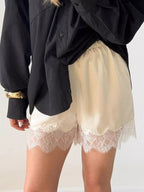 Elegant lace shorts showcasing intricate design and refined craftsmanship for sophisticated summer fashion.
