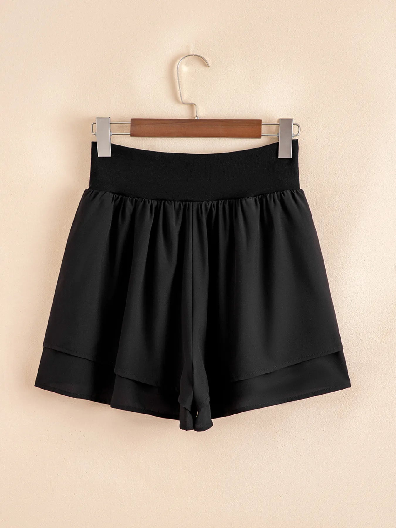 Elegant ruffle shorts perfect for formal occasions, combining style and comfort with a chic design.