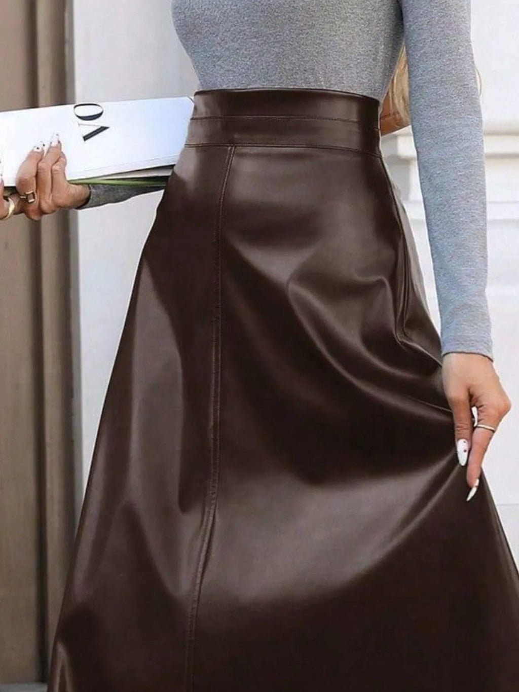Elegant leather skirt showcasing premium craftsmanship, perfect for formal occasions and stylish wardrobes.