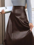 Elegant leather skirt showcasing premium craftsmanship, perfect for formal occasions and stylish wardrobes.