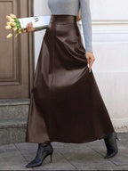 Elegant leather skirt showcasing premium craftsmanship, perfect for formal occasions and stylish wardrobes.
