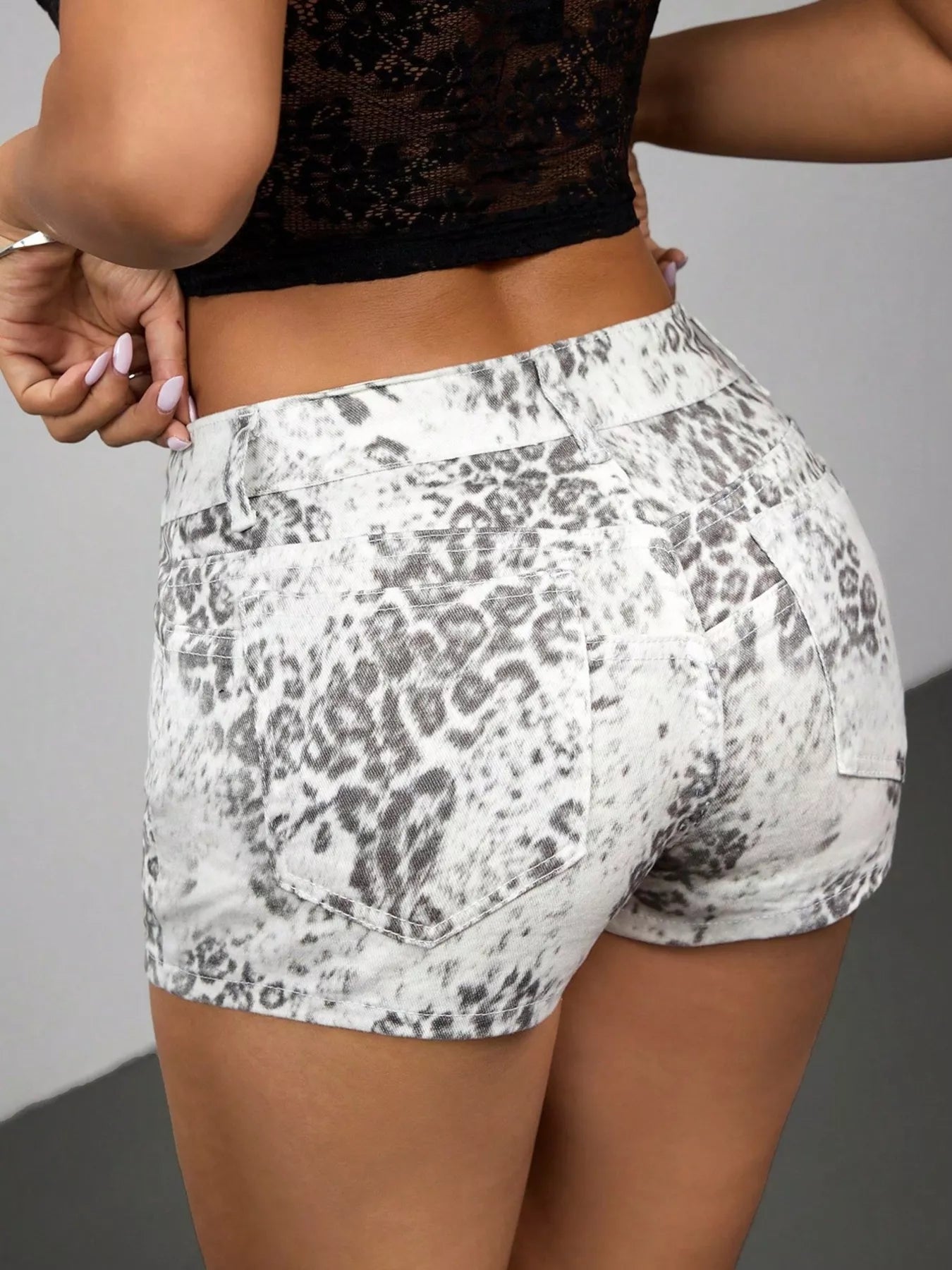 Stylish leopard print paired with classic denim shorts for a trendy summer outfit look