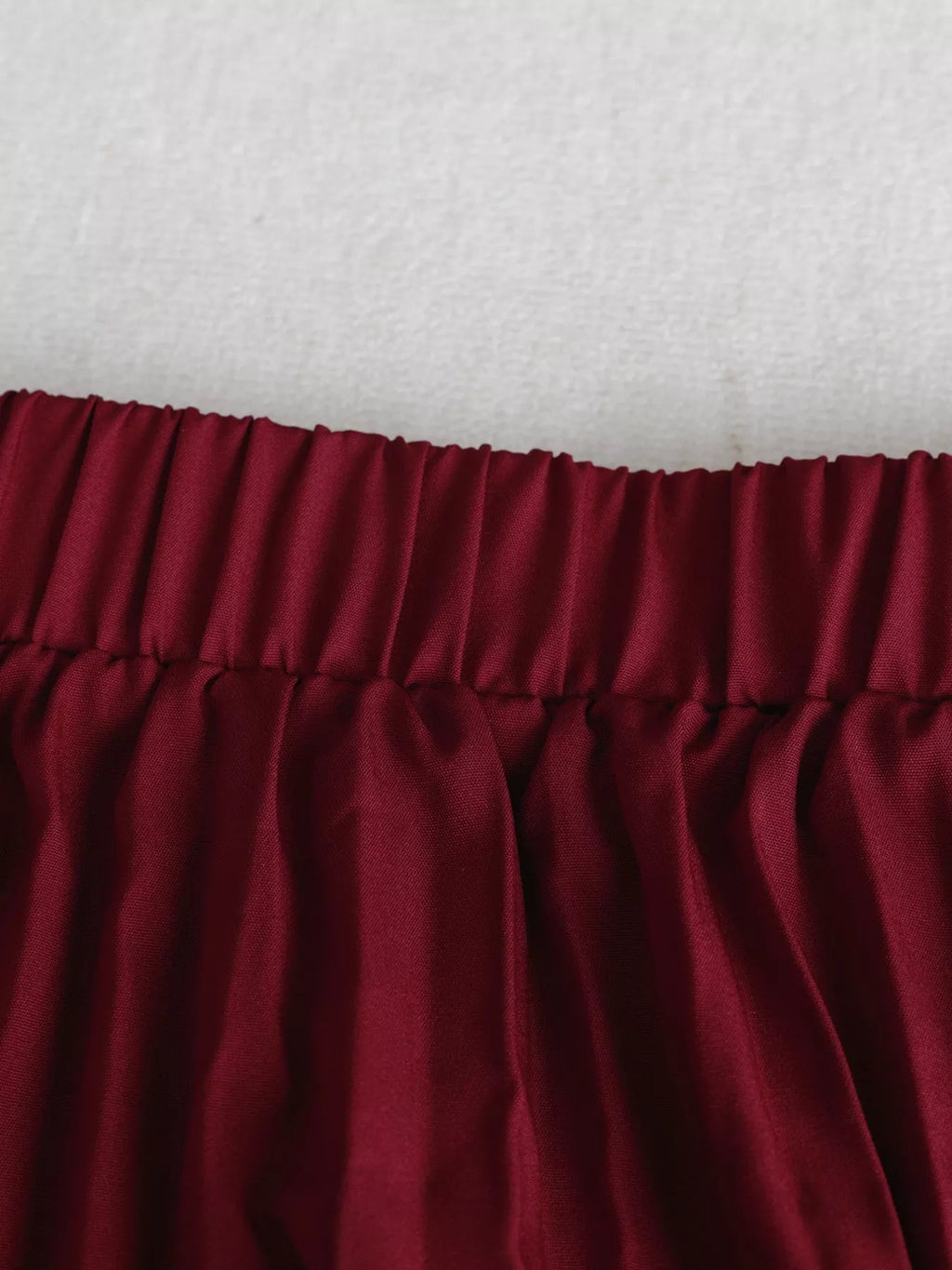 Elegant pleated midi skirt showcasing classic skirt design perfect for formal occasions and stylish outfits.