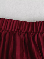 Elegant pleated midi skirt showcasing classic skirt design perfect for formal occasions and stylish outfits.