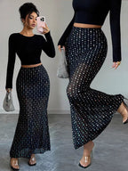 Elegant polka dot maxi skirt showcasing classic design and flowing silhouette for stylish summer wear