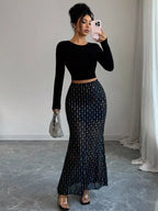 Elegant polka dot maxi skirt showcasing classic design and flowing silhouette for stylish summer wear