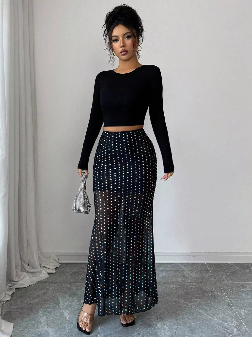 Elegant polka dot maxi skirt showcasing classic design and flowing silhouette for stylish summer wear