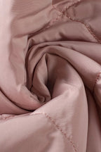 Quilted Sherpa-lined vest providing warmth and style, perfect for cold weather layering