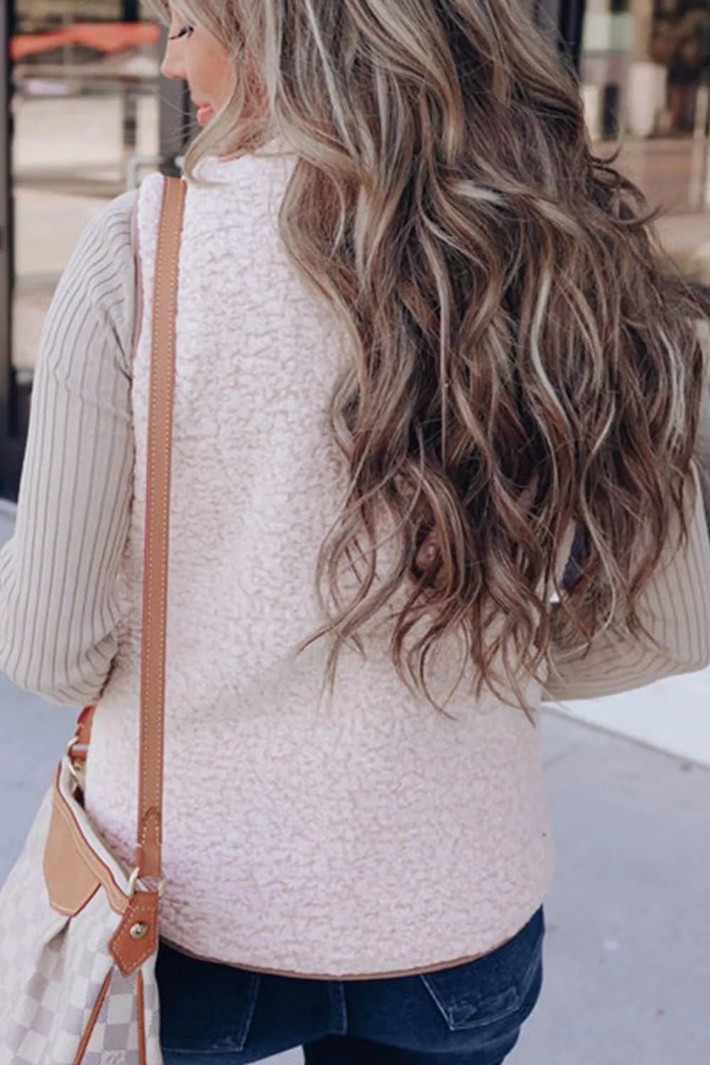 Quilted Sherpa-lined vest providing warmth and style, perfect for cold weather layering