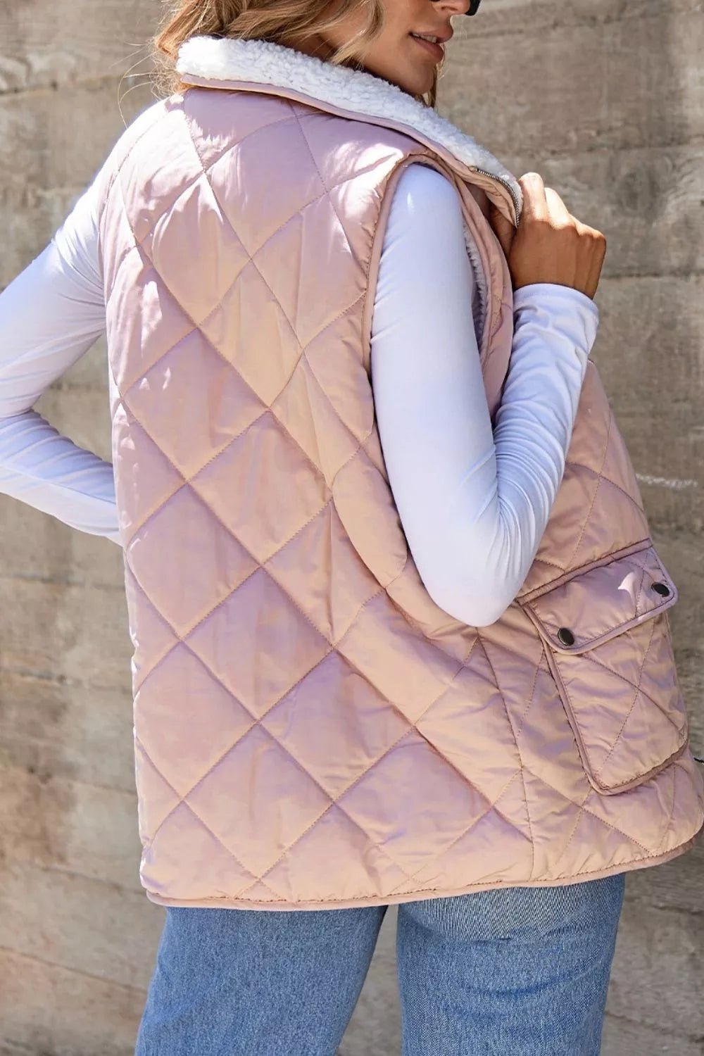 Quilted Sherpa-lined vest providing warmth and style, perfect for cold weather layering
