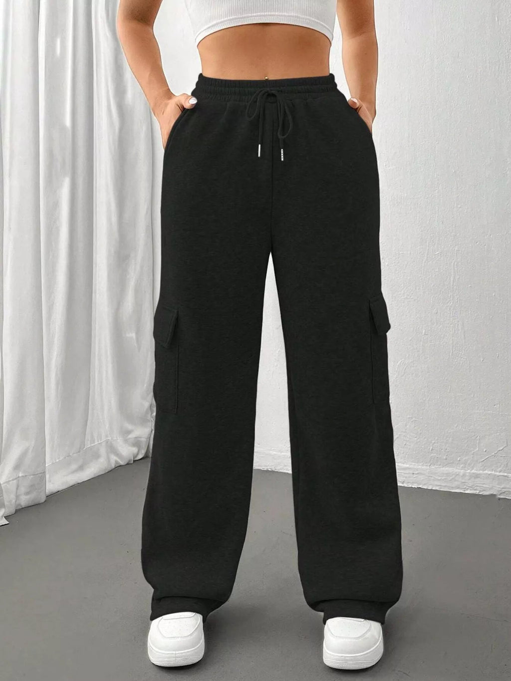 Comfortable relaxed fit pants featuring a drawstring waist for adjustable and stylish wear