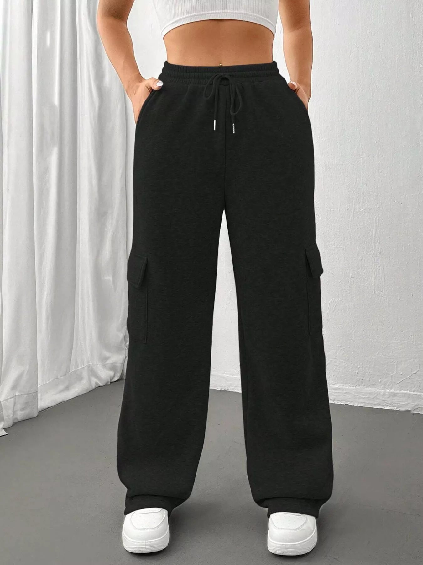 Comfortable relaxed fit pants featuring a drawstring waist for adjustable and stylish wear