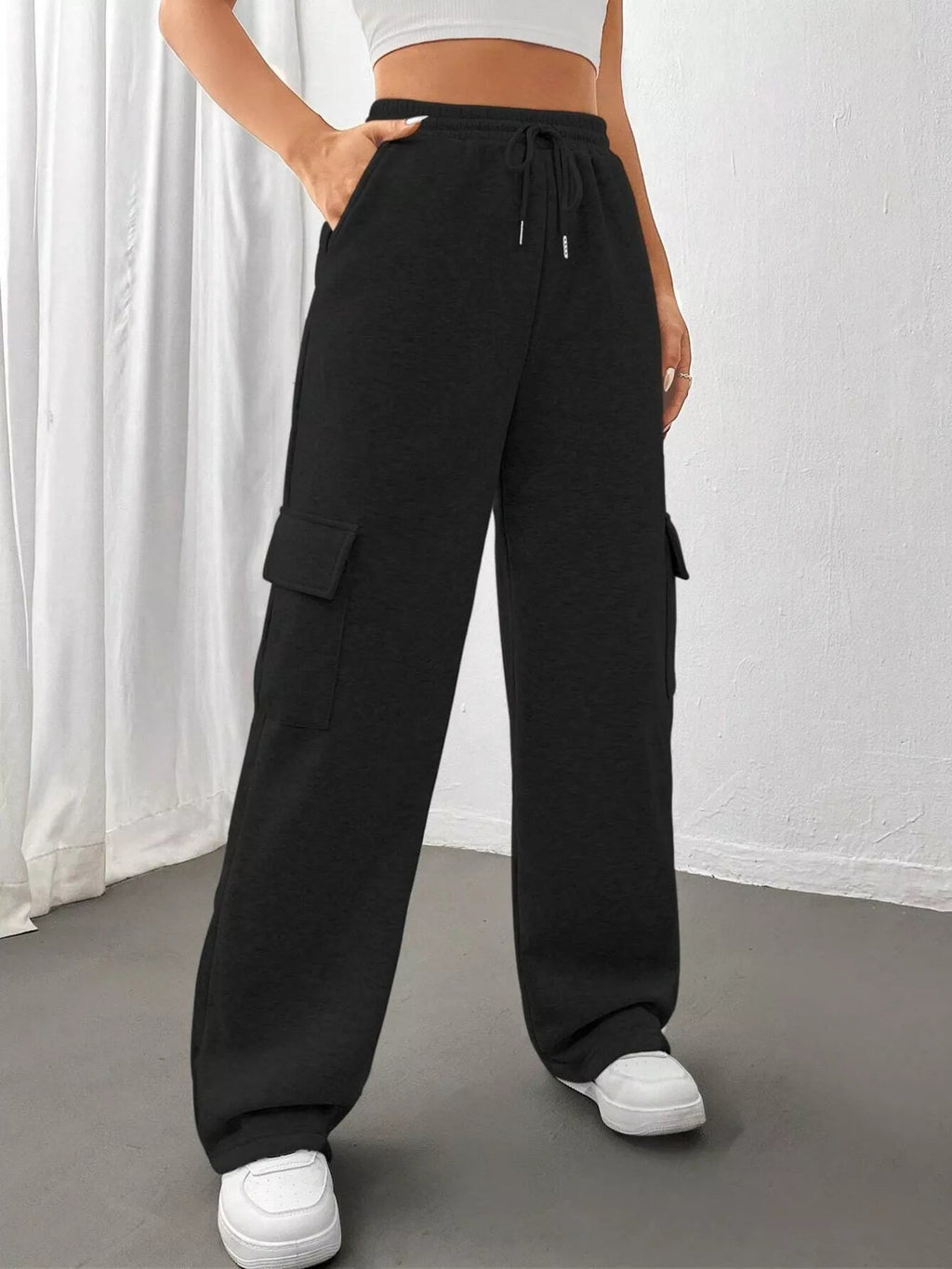 Comfortable relaxed fit pants featuring a drawstring waist for adjustable and stylish wear