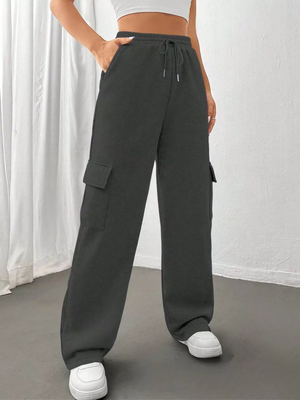 Comfortable relaxed fit pants featuring a drawstring waist for adjustable and stylish wear