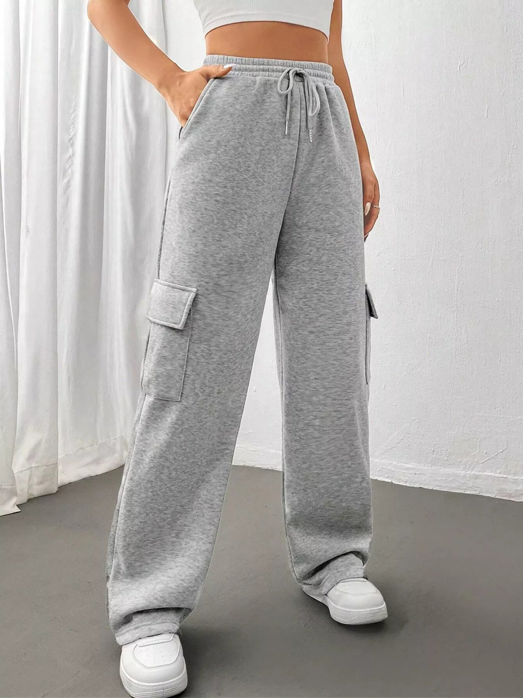 Comfortable relaxed fit pants featuring a drawstring waist for adjustable and stylish wear