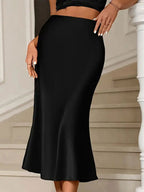 Elegant satin midi skirt showcasing sophisticated design and luxurious fabric for formal occasions