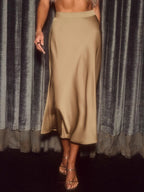 Elegant satin midi skirt showcasing smooth texture and versatile style in fashionable women's wardrobe