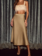 Elegant satin midi skirt showcasing smooth texture and versatile style in fashionable women's wardrobe