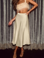 Elegant satin midi skirt showcasing smooth texture and versatile style in fashionable women's wardrobe