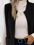 Warm sleeveless fleece vest ideal for layering, offering comfort and versatility in cold weather.