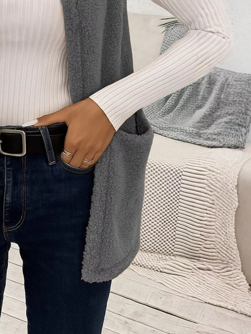 Warm sleeveless fleece vest ideal for layering, offering comfort and versatility in cold weather.