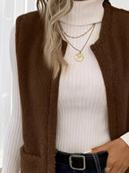 Warm sleeveless fleece vest ideal for layering, offering comfort and versatility in cold weather.