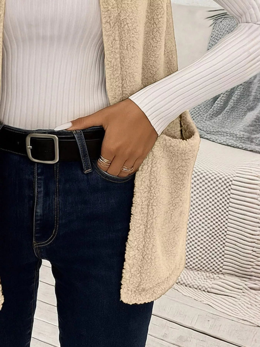 Warm sleeveless fleece vest ideal for layering, offering comfort and versatility in cold weather.